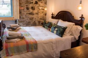 Ένα ή περισσότερα κρεβάτια σε δωμάτιο στο Casa Do Populo