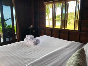 Postel nebo postele na pokoji v ubytování Itsara bungalow