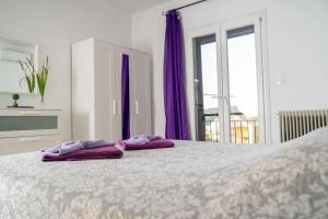 Postel nebo postele na pokoji v ubytování Coralli Pentati 1 "Dimitris Apartments"