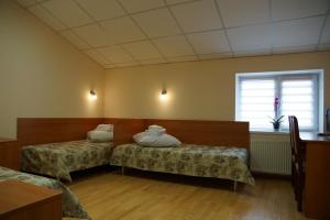 Postel nebo postele na pokoji v ubytování Hotel Nova