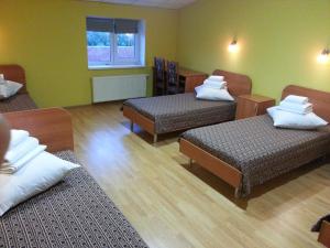 Postel nebo postele na pokoji v ubytování Hotel Nova