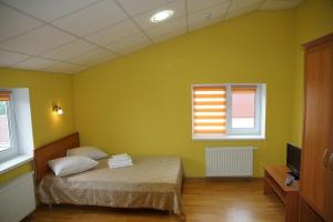 Postel nebo postele na pokoji v ubytování Hotel Nova