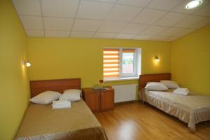 Postel nebo postele na pokoji v ubytování Hotel Nova