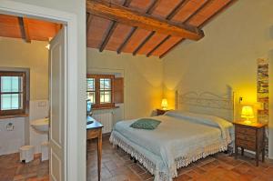 Postel nebo postele na pokoji v ubytování Le Ginestre B & B