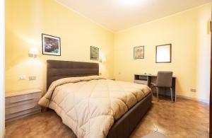 Postel nebo postele na pokoji v ubytování Hotel Aurelia