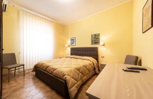 Postel nebo postele na pokoji v ubytování Hotel Aurelia