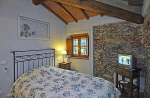 Postel nebo postele na pokoji v ubytování Le Ginestre B & B