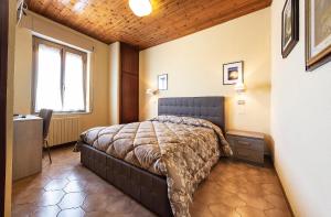 Postel nebo postele na pokoji v ubytování Hotel Aurelia