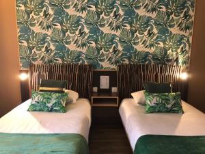 Postel nebo postele na pokoji v ubytování Hôtel Burnichon + 37 fotografií