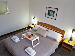 Postel nebo postele na pokoji v ubytování Guesthouse Kovačević
