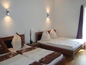 En eller flere senge i et værelse på Appartements Altes Gericht