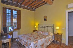Postel nebo postele na pokoji v ubytování Le Ginestre B & B
