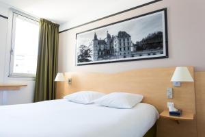 Postel nebo postele na pokoji v ubytování Hotel inn Grenoble Eybens Parc des Expositions Ex Kyriad