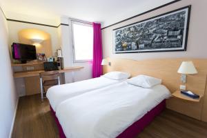 Postel nebo postele na pokoji v ubytování Hotel inn Grenoble Eybens Parc des Expositions Ex Kyriad