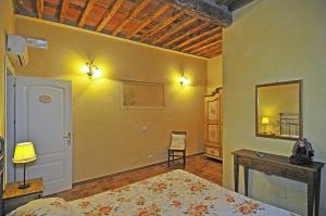 Postel nebo postele na pokoji v ubytování Le Ginestre B & B