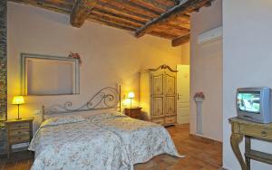 Postel nebo postele na pokoji v ubytování Le Ginestre B & B