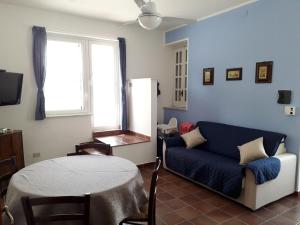 a living room with a couch and a table at Casa BabbaLuciana in Mondello