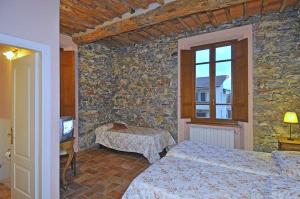 Postel nebo postele na pokoji v ubytování Le Ginestre B & B