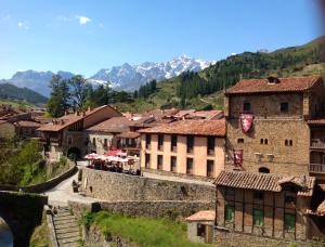 a view of a town with mountains in the background at Casa Cayo in Potes