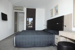 Ένα ή περισσότερα κρεβάτια σε δωμάτιο στο Dionysos Central