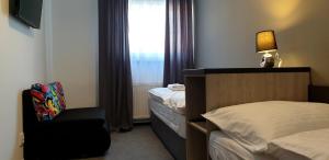 Postel nebo postele na pokoji v ubytování Třeboňské Apartmány