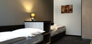 Postel nebo postele na pokoji v ubytování Třeboňské Apartmány
