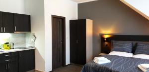 Postel nebo postele na pokoji v ubytování Třeboňské Apartmány