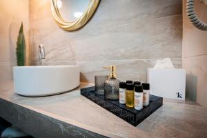a bathroom counter with a sink and a mirror at Deluxe Studio G 12 in Rovinj