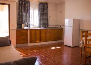 Кухня или мини-кухня в Apartamentos Bellavista Bolonia
