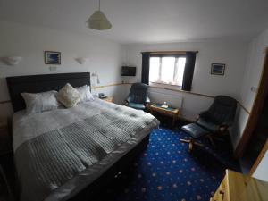 Postel nebo postele na pokoji v ubytování Orkneylodge