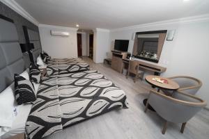 Voodi või voodid majutusasutuse Hotel Monaco toas