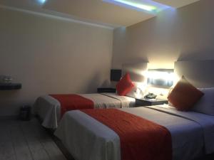 Voodi või voodid majutusasutuse Hotel Monaco toas