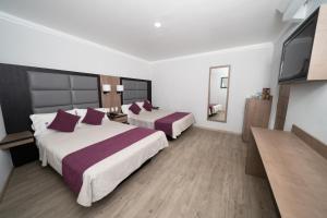Voodi või voodid majutusasutuse Hotel Monaco toas