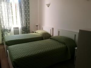 Postel nebo postele na pokoji v ubytování Il Melograno