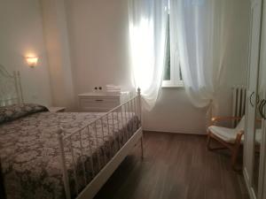 Postel nebo postele na pokoji v ubytování Il Melograno