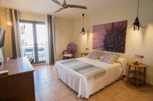 Postel nebo postele na pokoji v ubytování Hotel La Posada De Paco - Spa & Adults Friendly