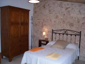 Ένα ή περισσότερα κρεβάτια σε δωμάτιο στο Can Granot