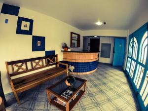 a room with a bar in the middle of a room at Coliseu Palace Residence in Florianópolis