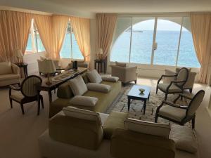 a living room with a couch and a table at Hotel Miramare & Spa in Sestri Levante