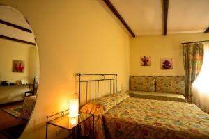 A bed or beds in a room at Agriturismo IL BORGHETTO