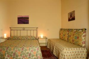 A bed or beds in a room at Agriturismo IL BORGHETTO