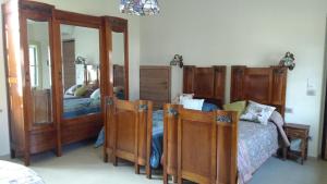 Postel nebo postele na pokoji v ubytování Agriturismo Cascina Poscallone