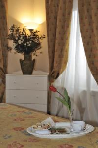 A bed or beds in a room at Agriturismo IL BORGHETTO