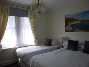 Ένα ή περισσότερα κρεβάτια σε δωμάτιο στο Southernhay Guest House