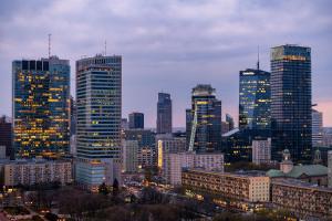 a city skyline at night with many tall buildings at Centrum ZGODA 6 FLOOR in Warsaw