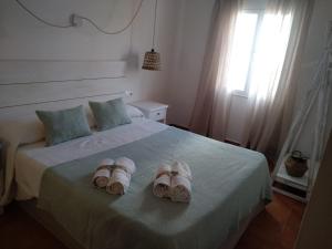 Hostal Sa Posada Set Cales客房内的一张或多张床位