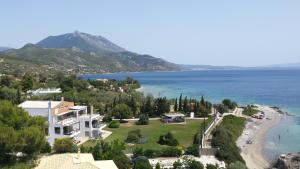 an aerial view of a resort with a beach at Beautiful house by the sea,Loutraki Skaloma. in Loutraki