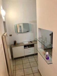 a bathroom with a sink and a mirror at Residenza Juvarra Deluxe in Turin