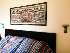 A bed or beds in a room at UMBRIA, "Casa Sagrantina" con PISCINA e pergolato