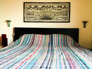 A bed or beds in a room at UMBRIA, "Casa Sagrantina" con PISCINA e pergolato